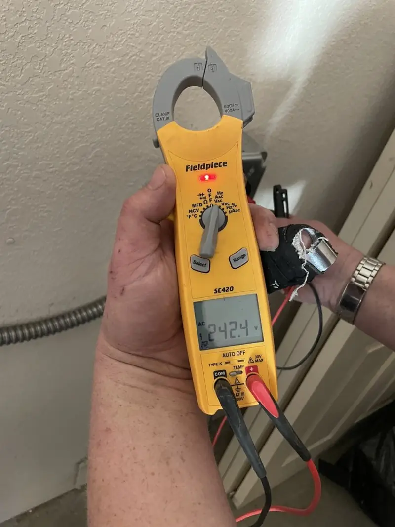 Voltage testing with clamp meter during Outlet Installation in North Salt Lake